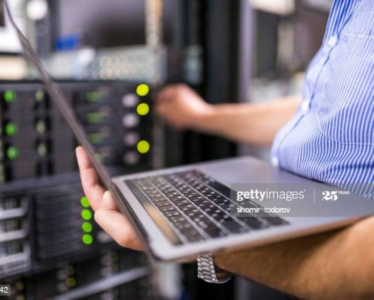 Engineer in the server room close-up. Photo taken at a Data Center in Bulgaria, Eastern Europe.